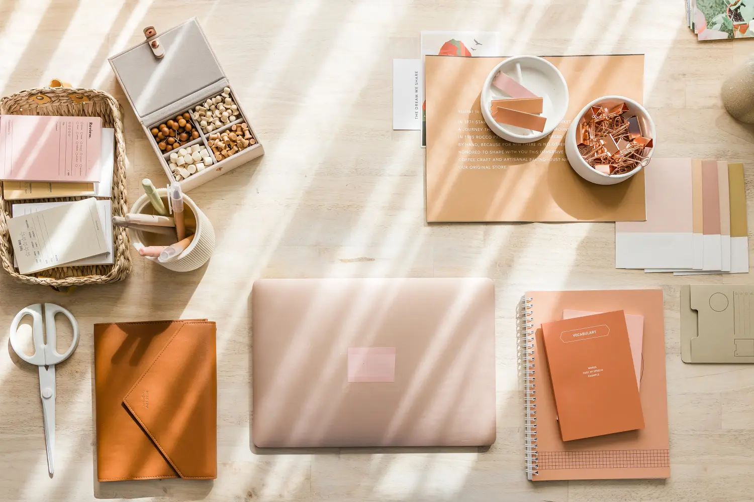 A beautifully styled workspace featuring a laptop, notebooks, stationery, and neutral tones, ideal for creative brand storytelling.