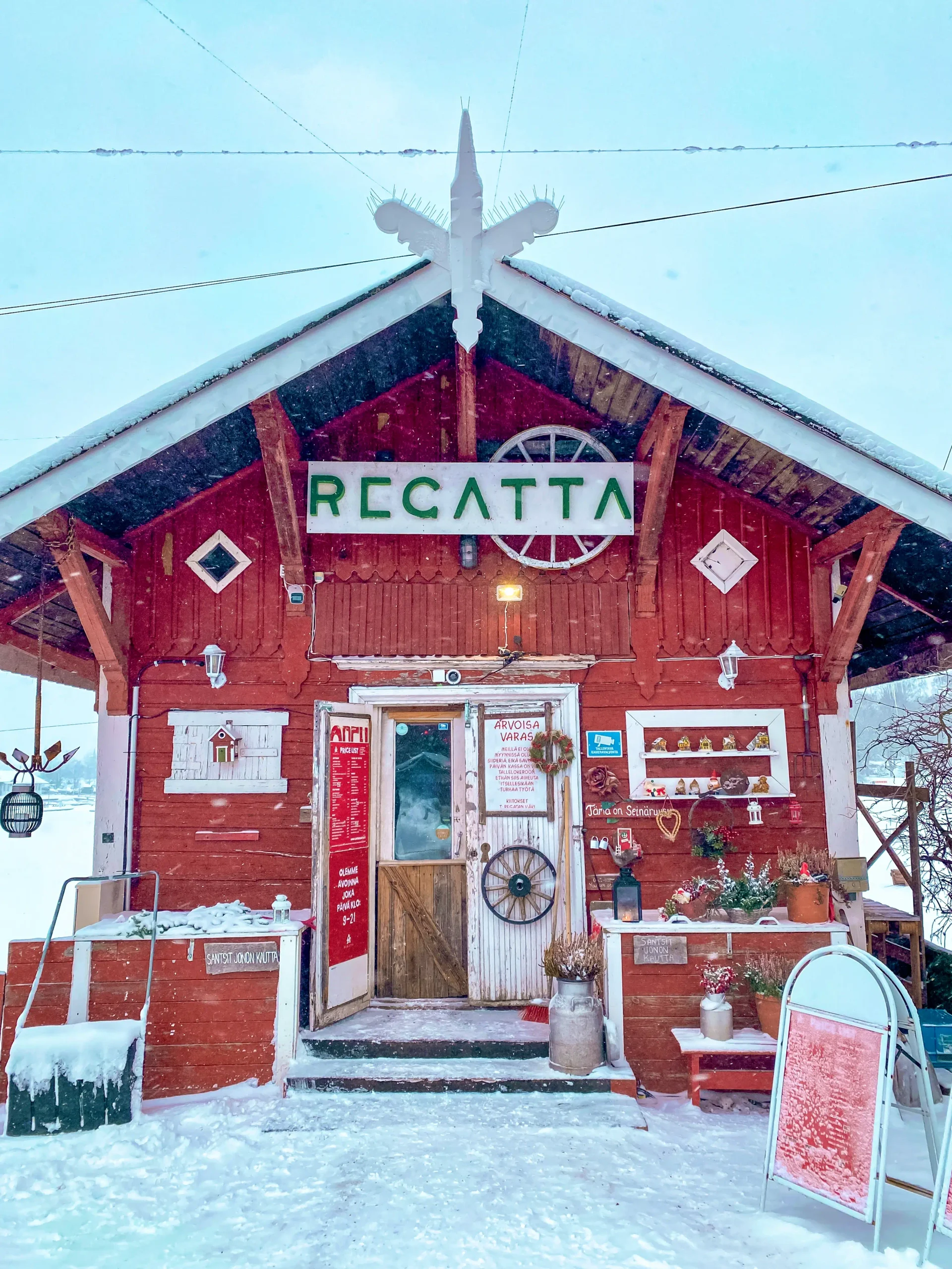 Red wooden Regatta café covered in snow in Helsinki.